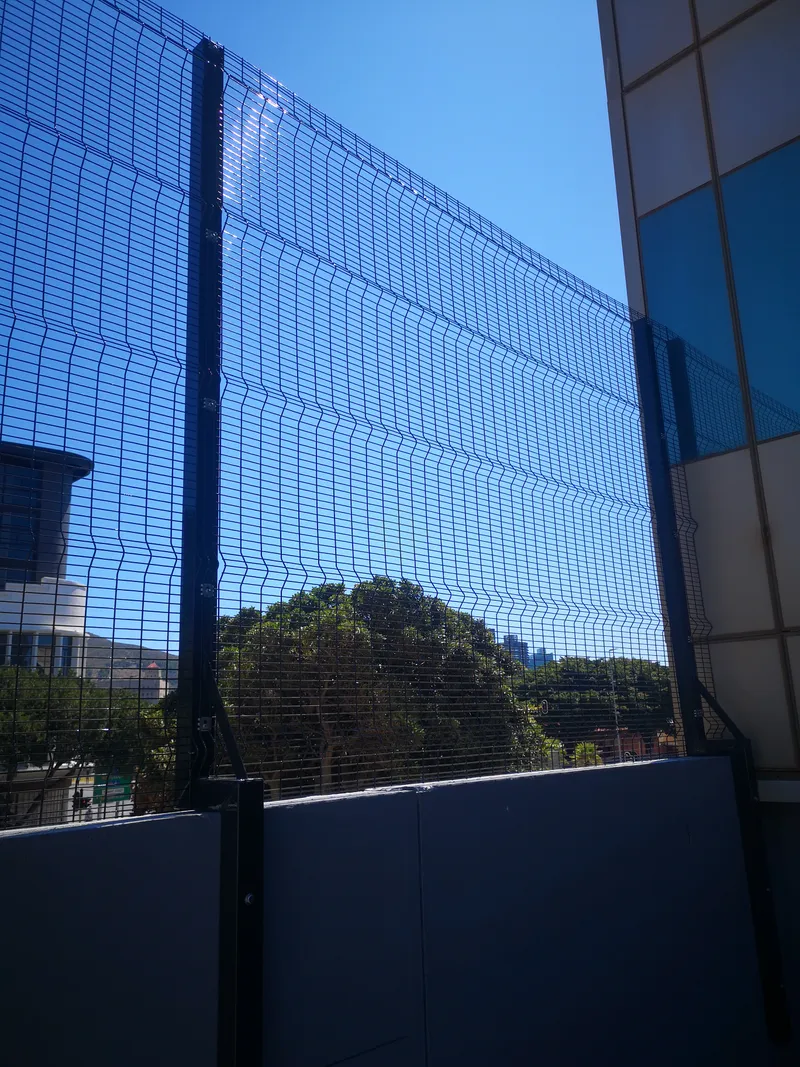 Tall Clearview mesh fence on commercial rooftop parking deck in Cape Town CBD