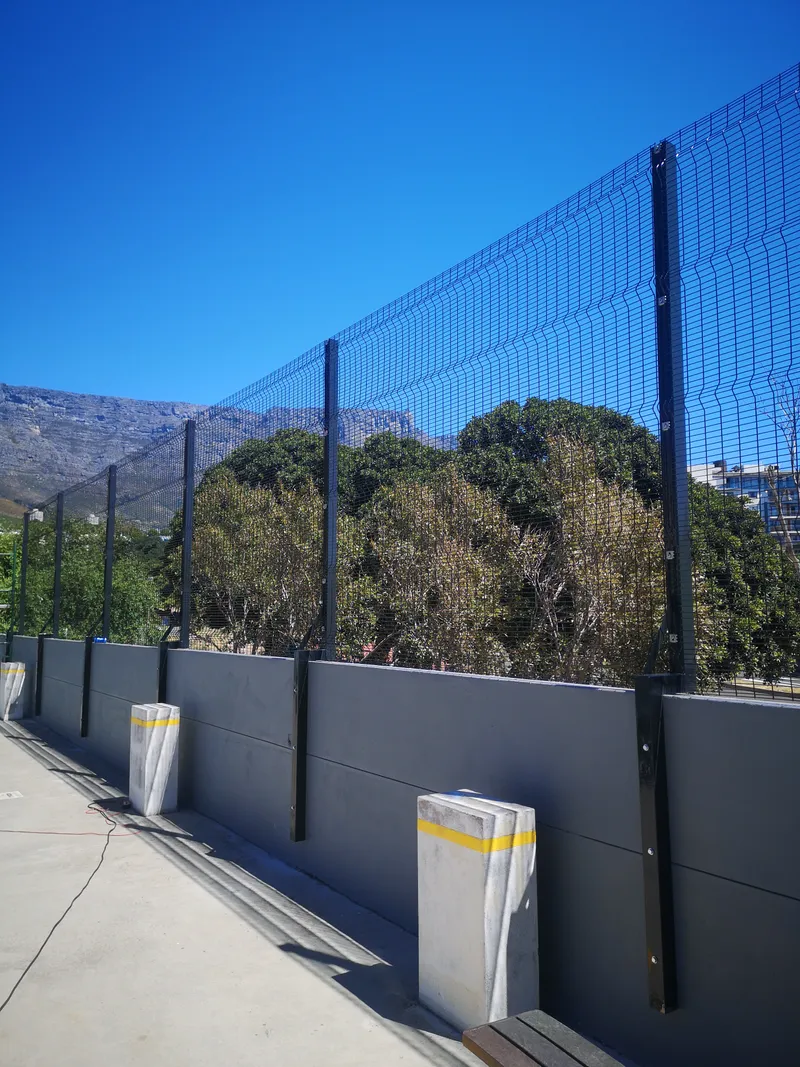 Clearview mesh fence on commercial perimeter wall with Table Mountain views Cape Town