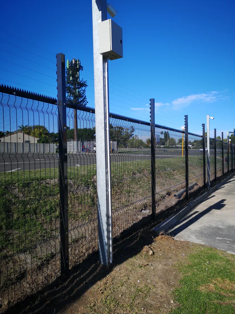 Clearview commercial fence with integrated CCTV pole and junction box in Cape Town