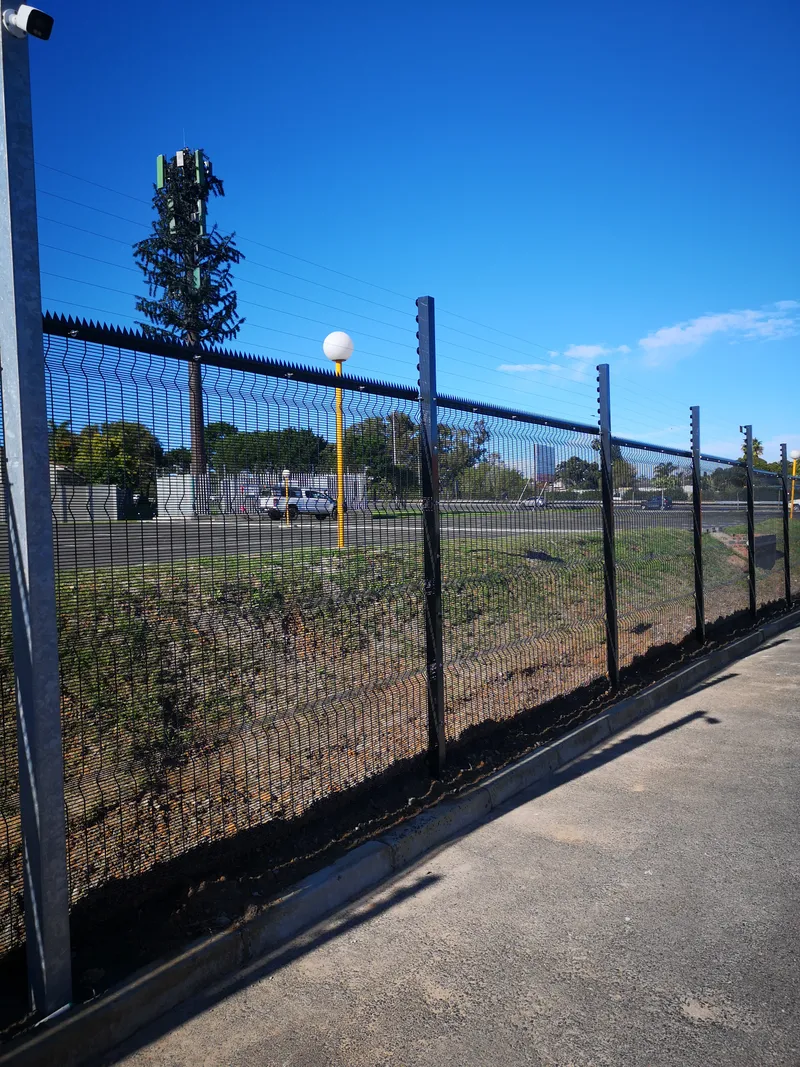 Black clearview perimeter fence with cellphone tower behind installed in Cape Town