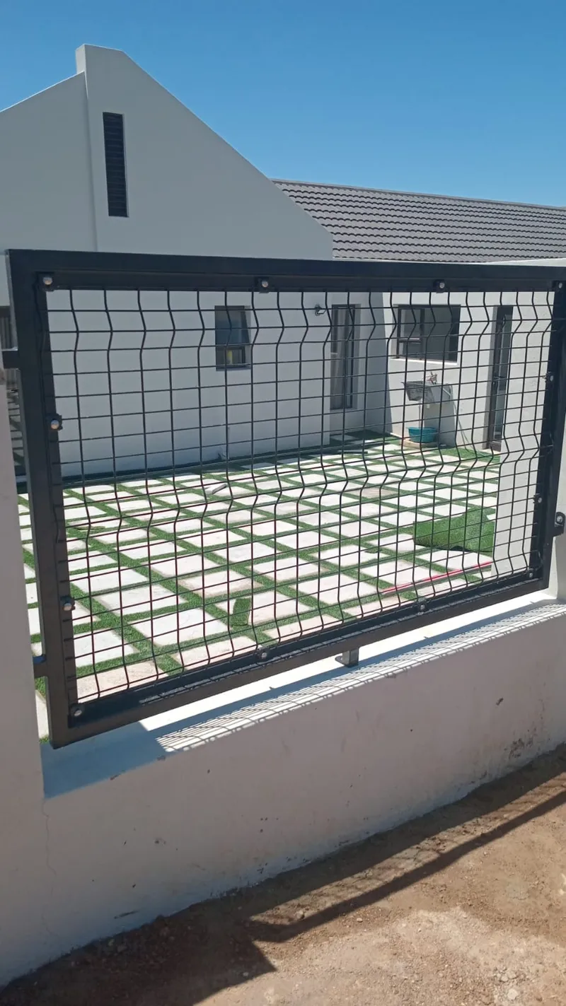 Clearview anti-climb mesh panel on white boundary wall in Western Cape home