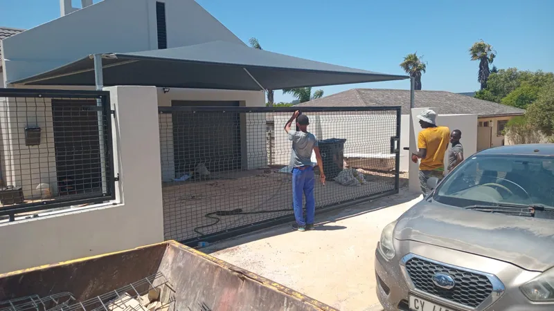 Clearview mesh driveway gate being fitted at Cape Town residential property