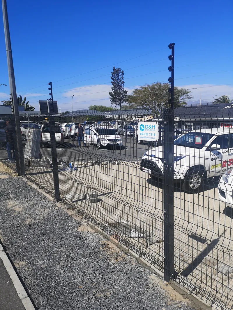 Clearview mesh fence with electric strands protecting commercial yard in Cape Town