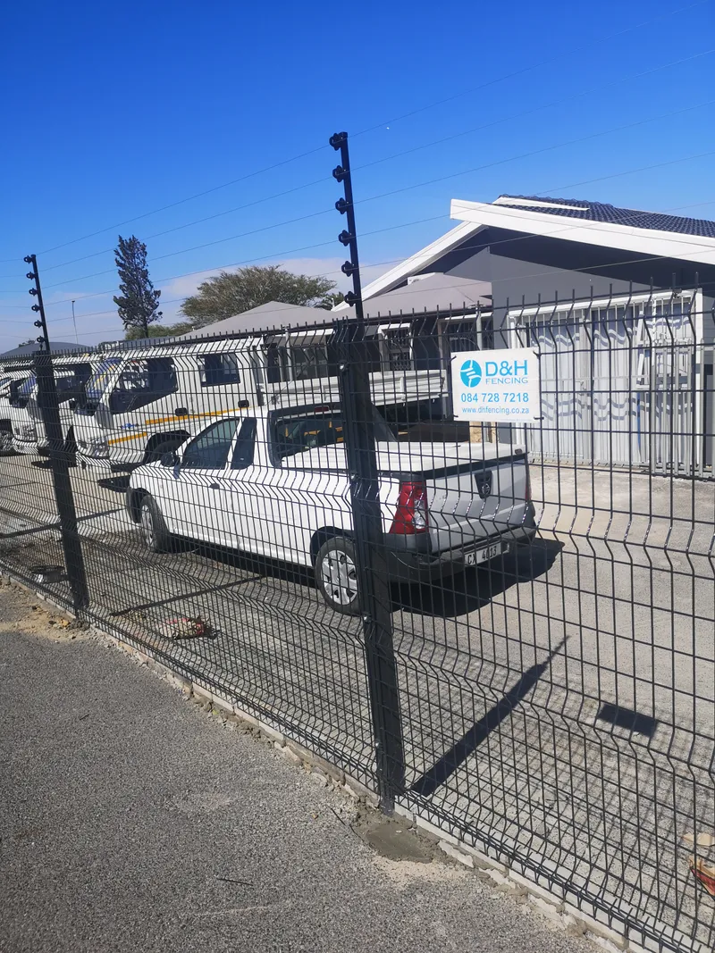 Completed clearview fence with electric wires around commercial premises in Cape Town