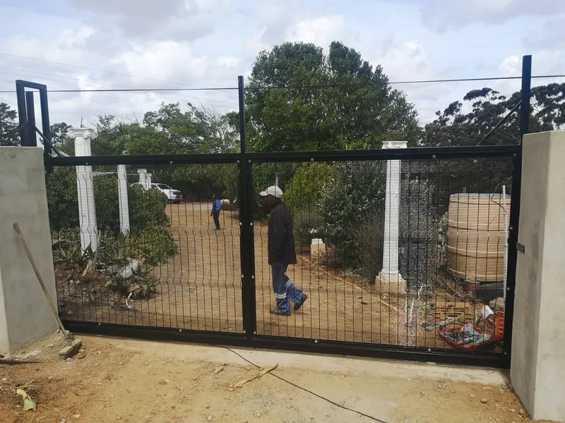 Black clearview mesh driveway gate installed at residential property in Western Cape
