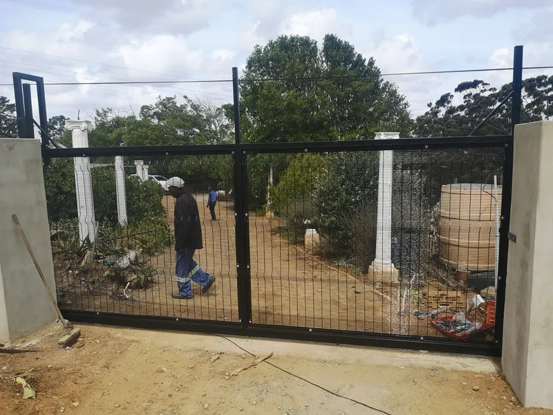 Newly installed clearview mesh driveway gate at rural Western Cape residence