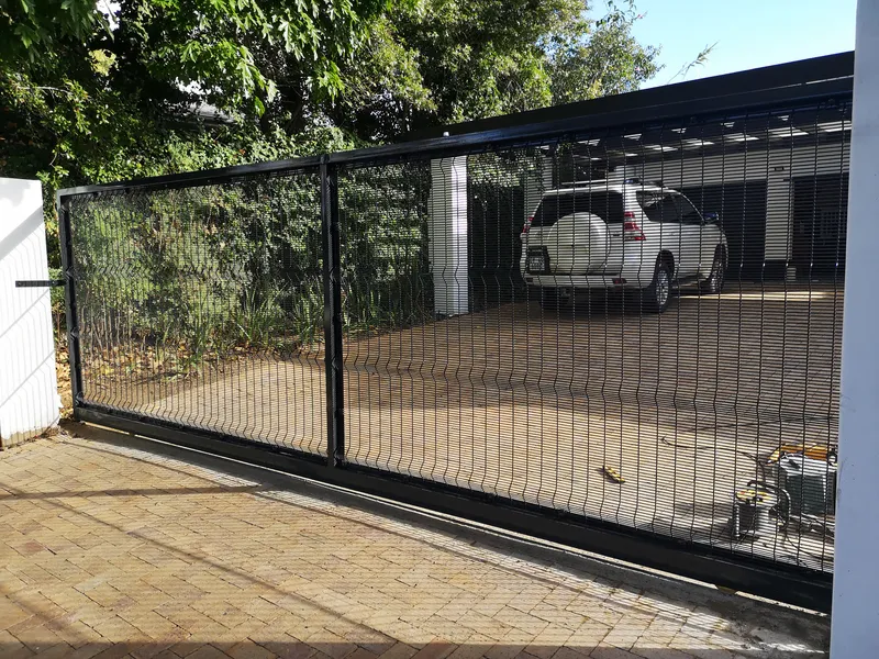 Black clearview mesh sliding driveway gate at residential home in Cape Town Western Cape