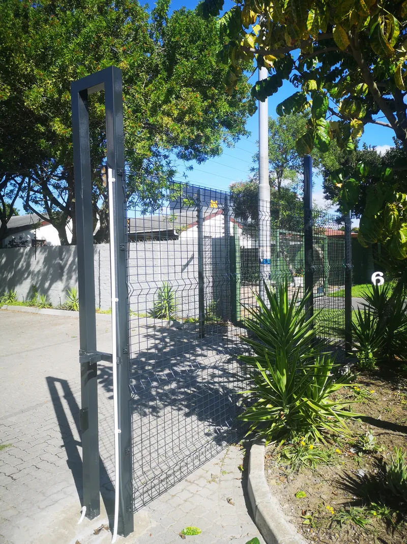 Clearview mesh pedestrian gate with steel posts at residential driveway in Cape Town