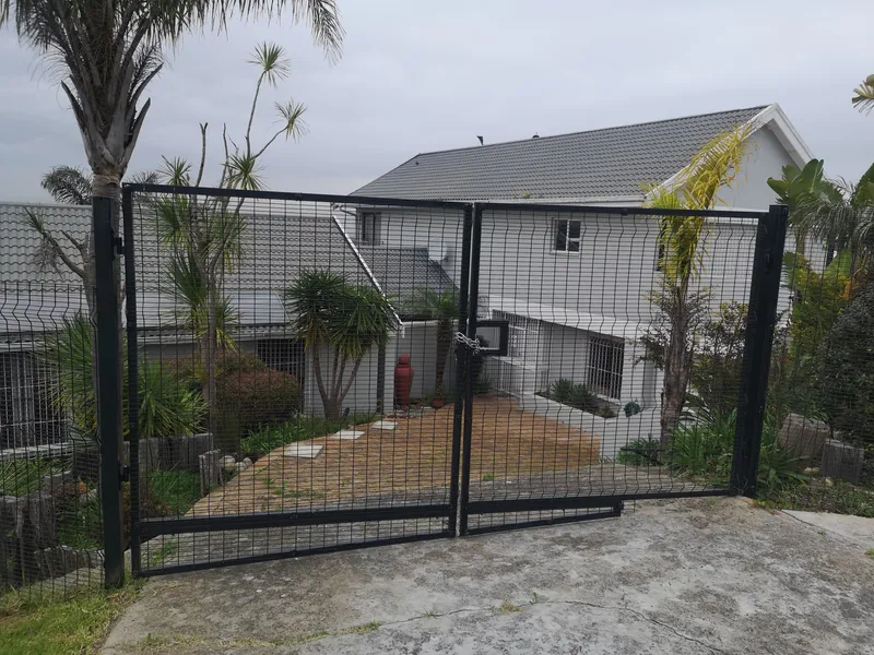 Black clearview mesh double driveway gate at residential home in Cape Town