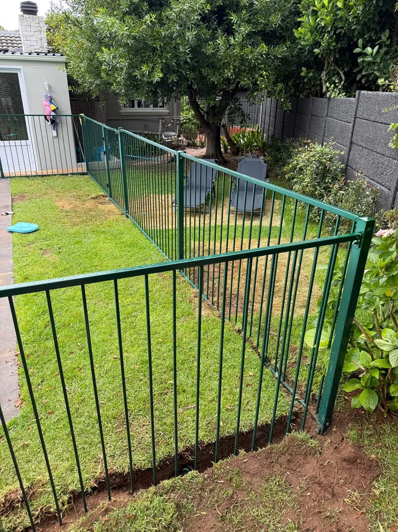 Steel bar pool fence in green powder-coated finish at a Cape Town garden pool area