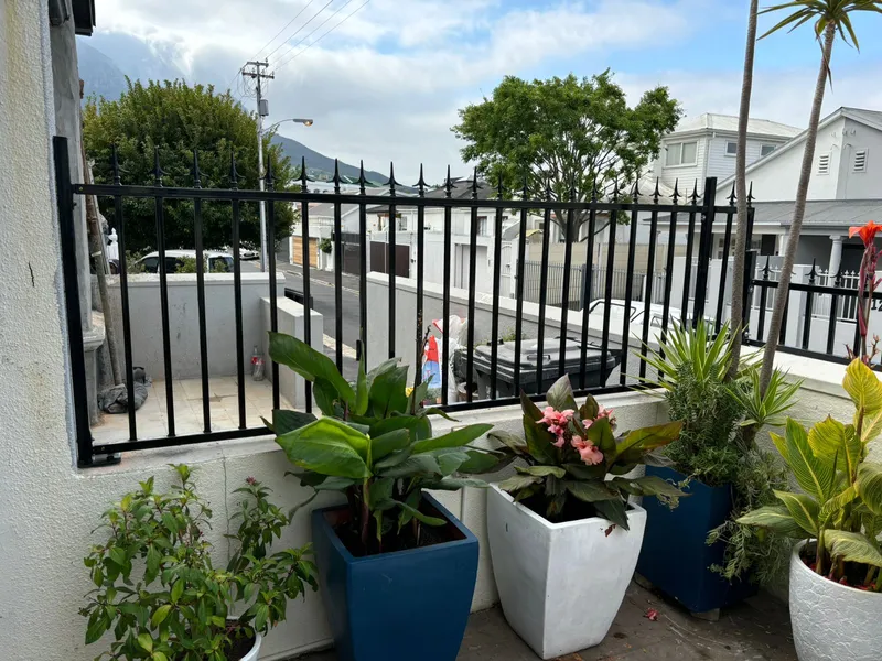 Black tubular steel balustrade fence with spike tops on Cape Town residential terrace