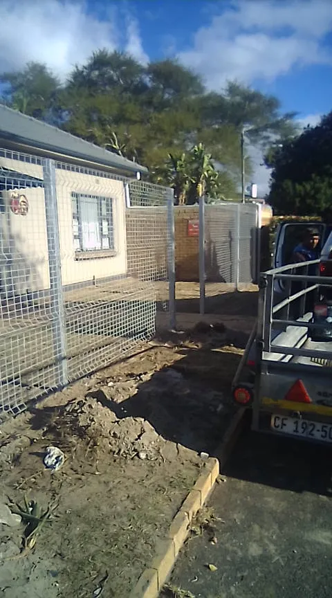 Galvanised mesh boundary fence under installation at Cape Town residential property