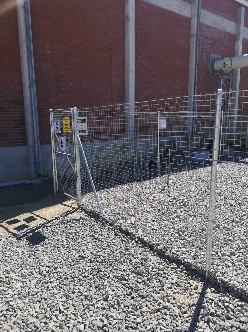Galvanised welded mesh pedestrian gate with safety signage at electrical substation in Cape Town