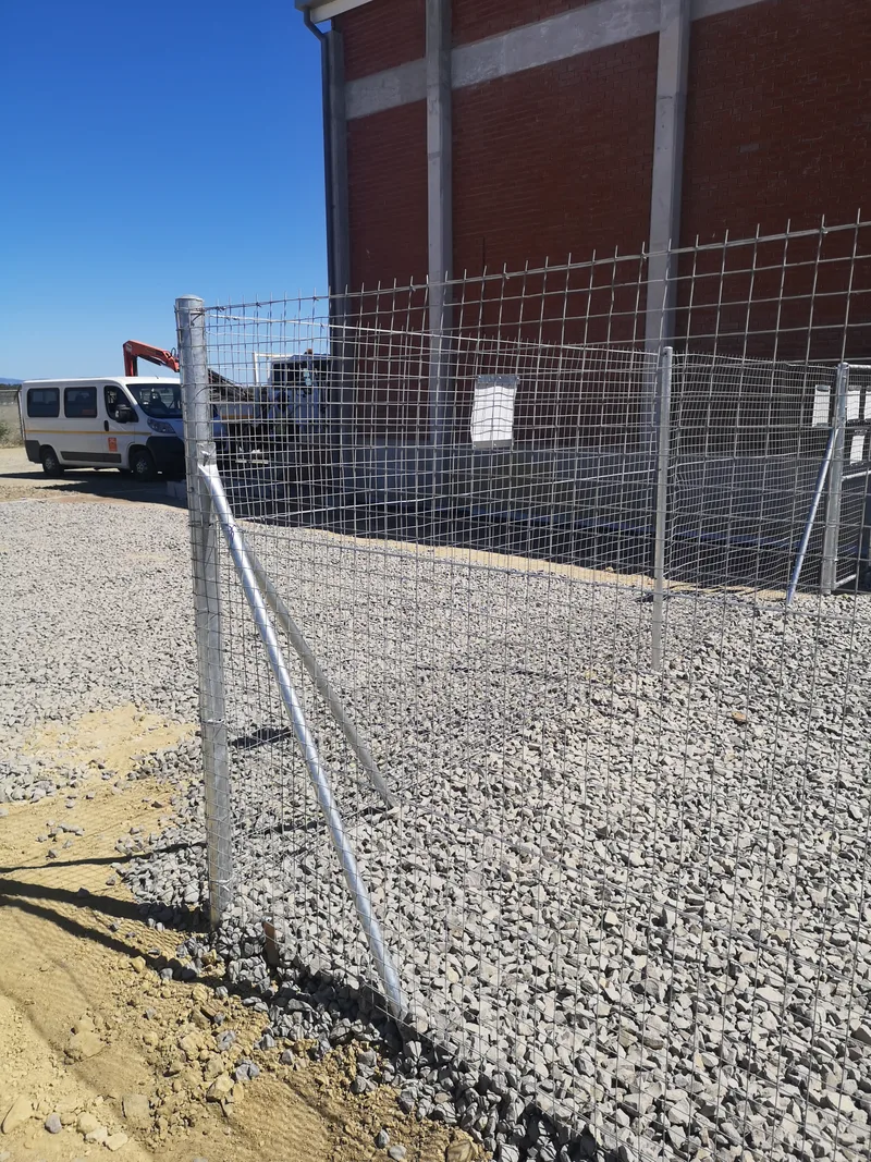 Galvanised welded mesh fence corner with diagonal post brace at Cape Town electrical substation